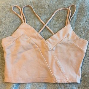 Peach color crop top with razor crossed back